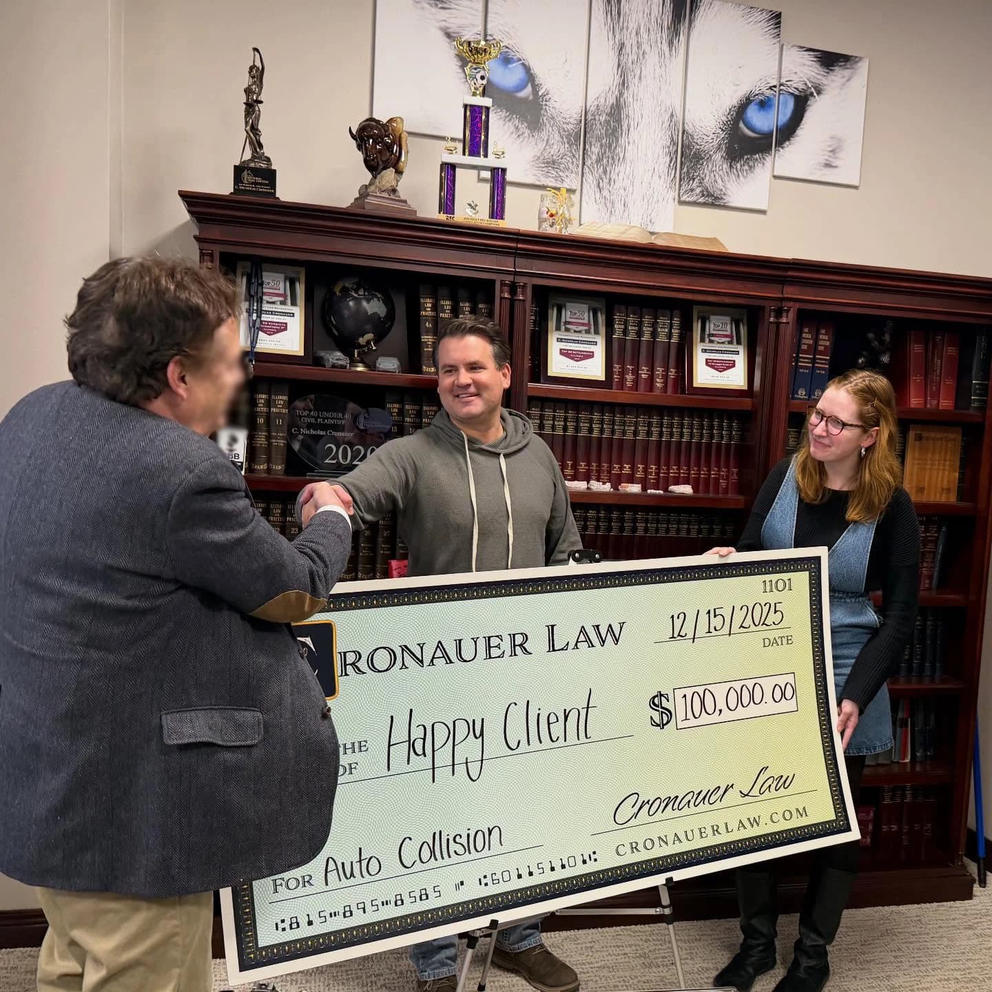 Cronauer Law client receiving settlement check