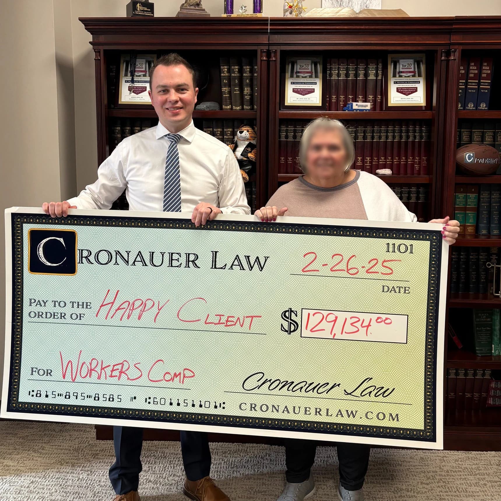 Cronauer Law client receiving settlement check