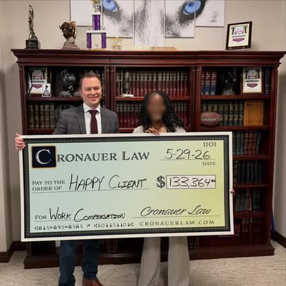 Cronauer Law client receiving settlement check