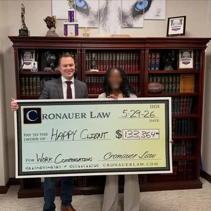 Cronauer Law client receiving settlement check