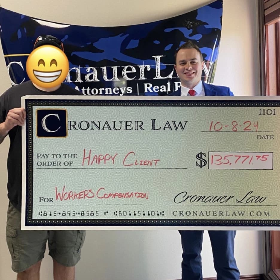 Cronauer Law client receiving settlement check