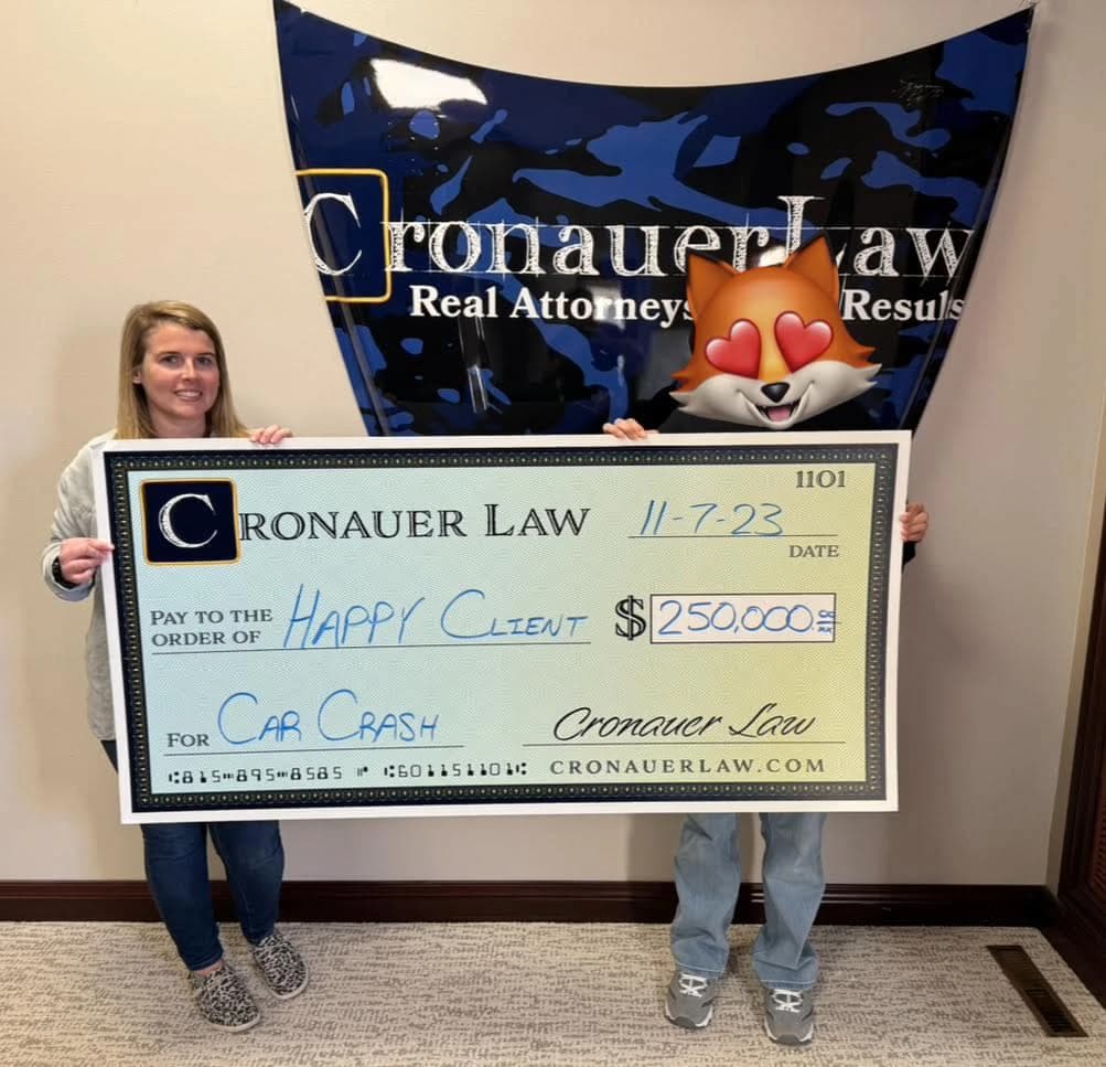 Cronauer Law client receiving settlement check