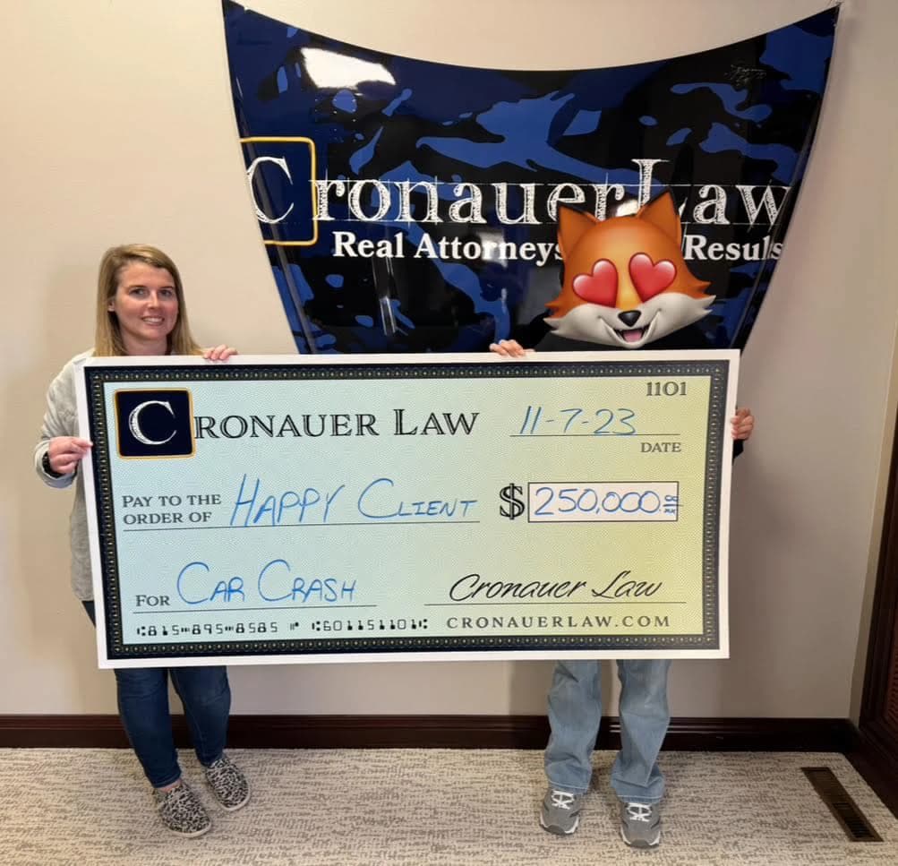 Cronauer Law client receiving settlement check