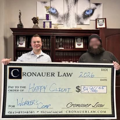 Cronauer Law client receiving settlement check