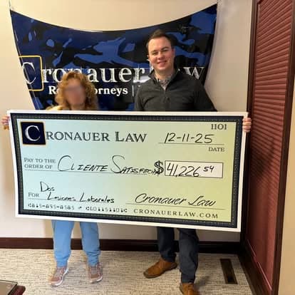 Cronauer Law client receiving settlement check