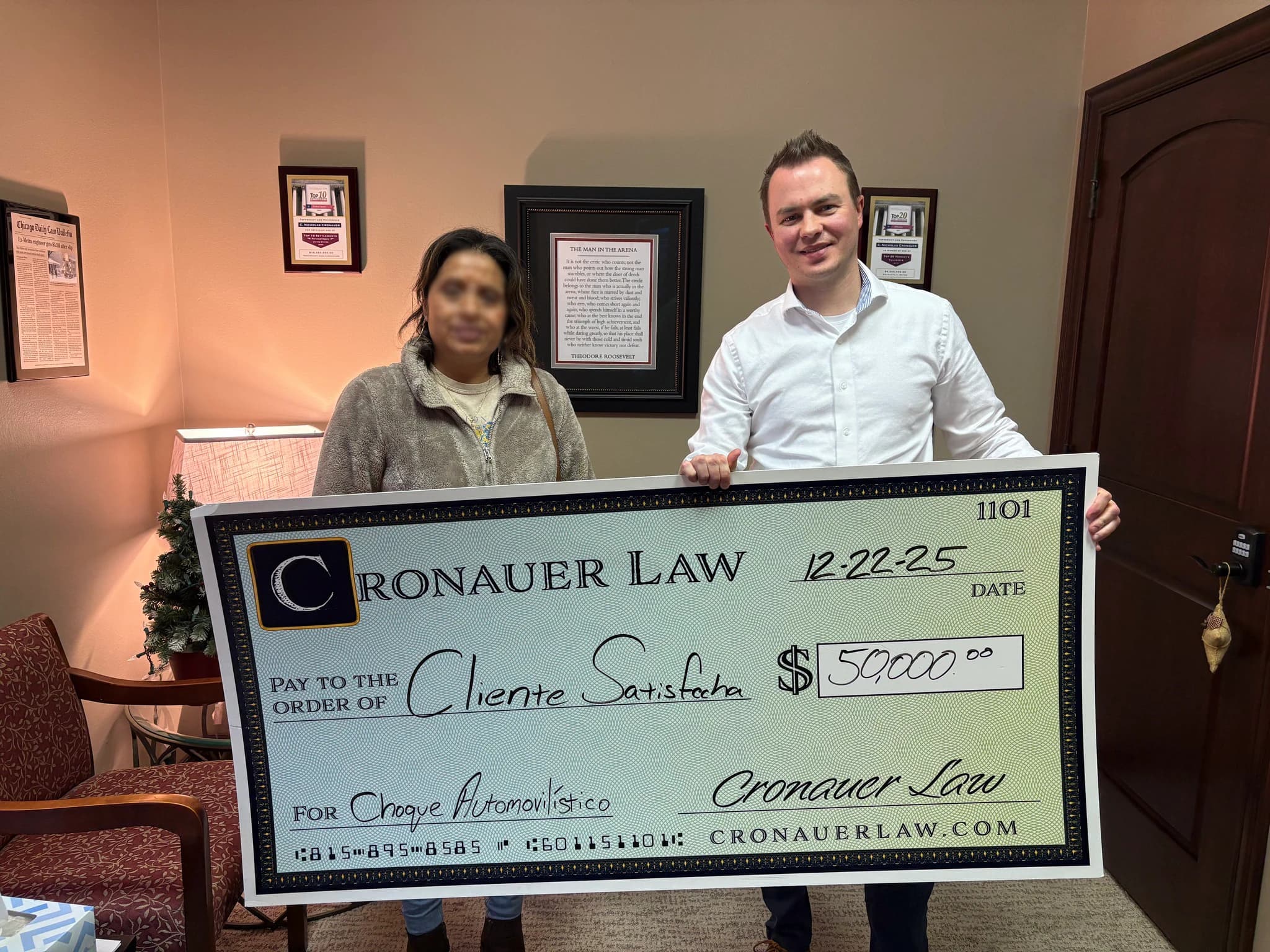 Cronauer Law client receiving settlement check