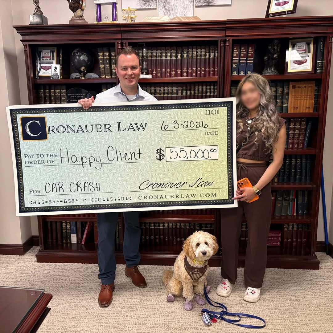 Cronauer Law client receiving settlement check