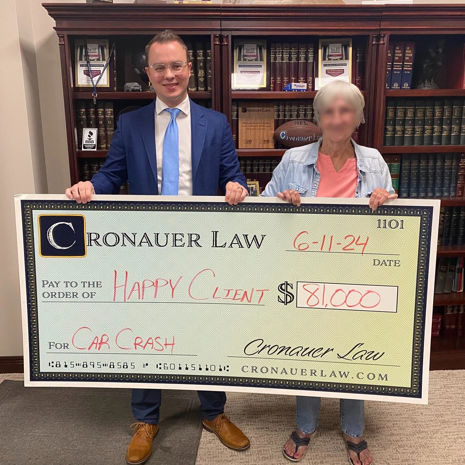Cronauer Law client receiving settlement check