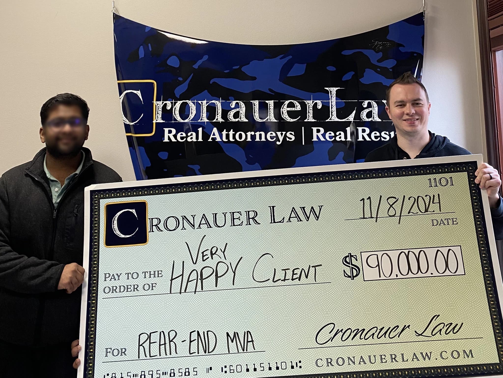 Cronauer Law client receiving settlement check