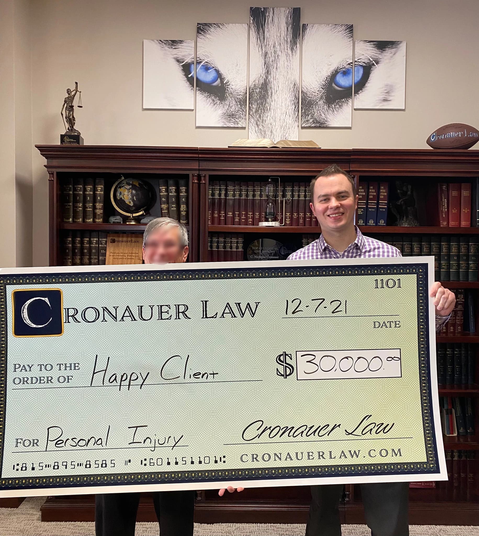 Cronauer Law client receiving settlement check