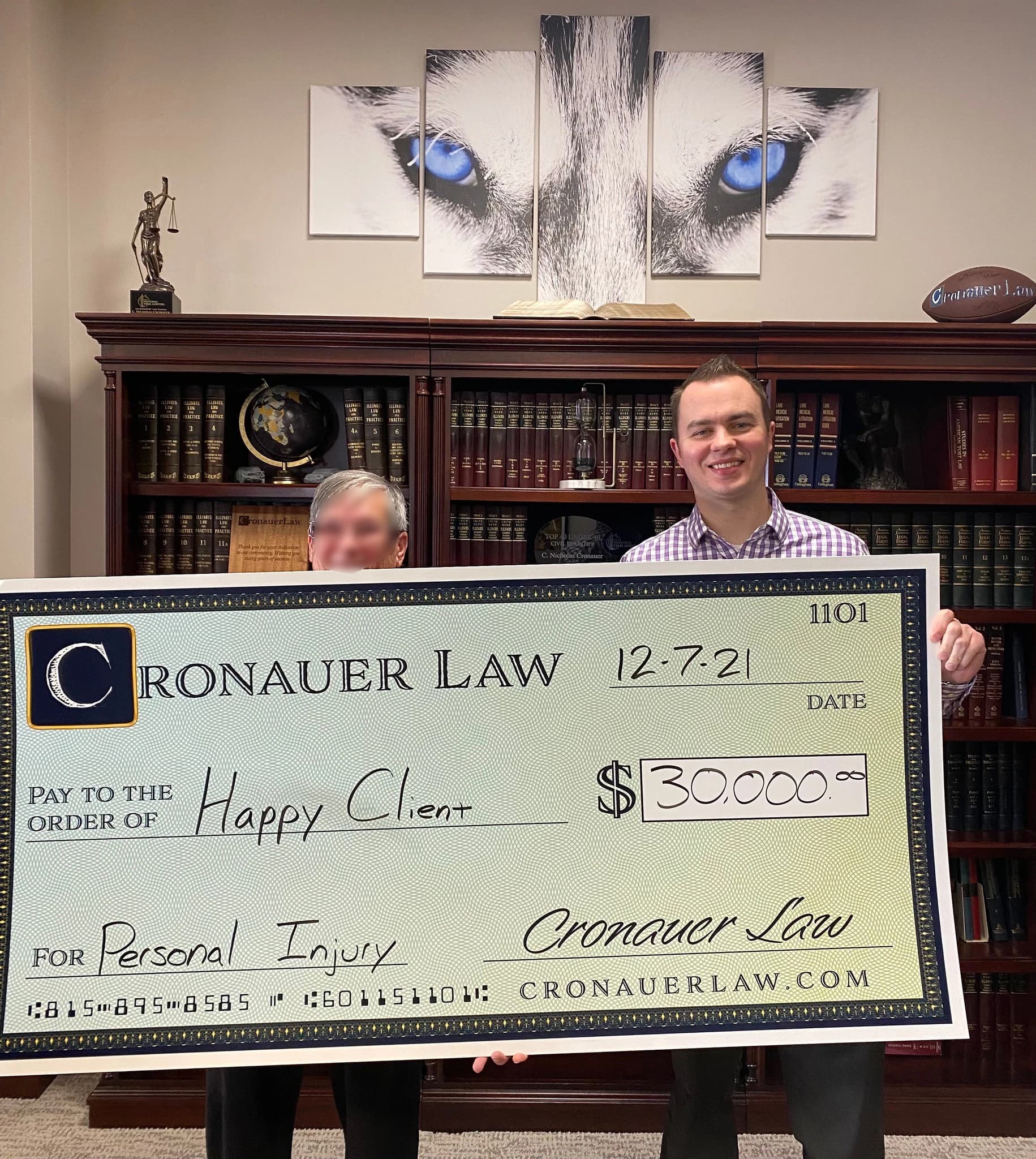 Cronauer Law client receiving settlement check