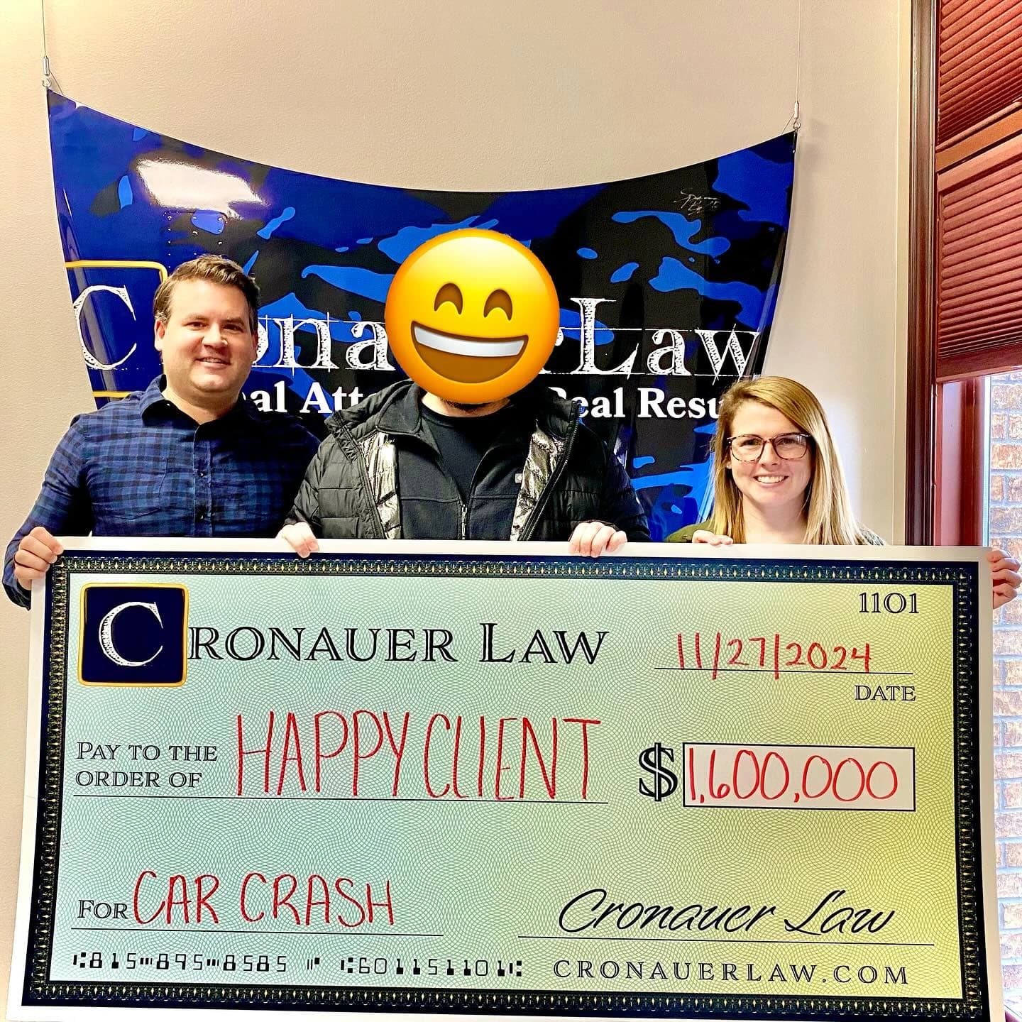 Cronauer Law client receiving settlement check