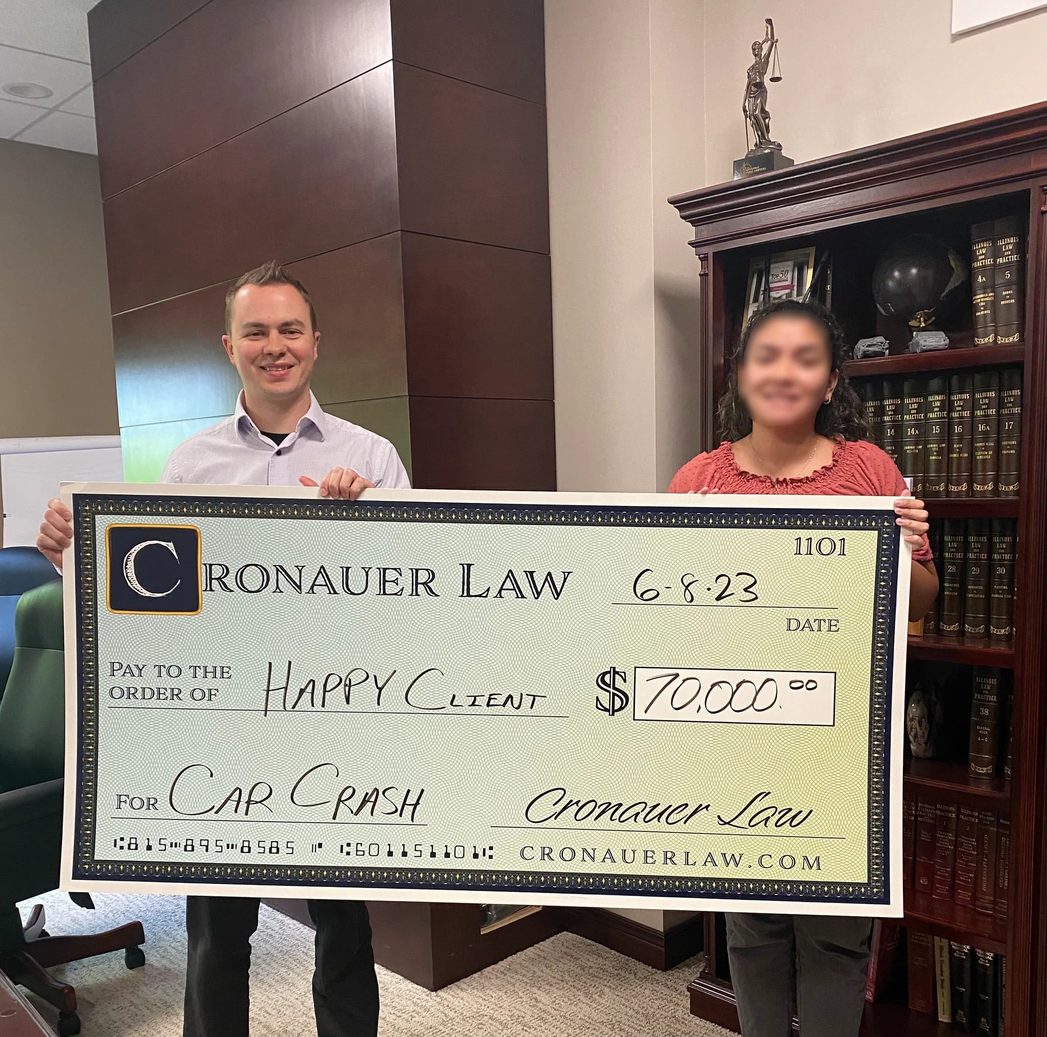 Cronauer Law client receiving settlement check