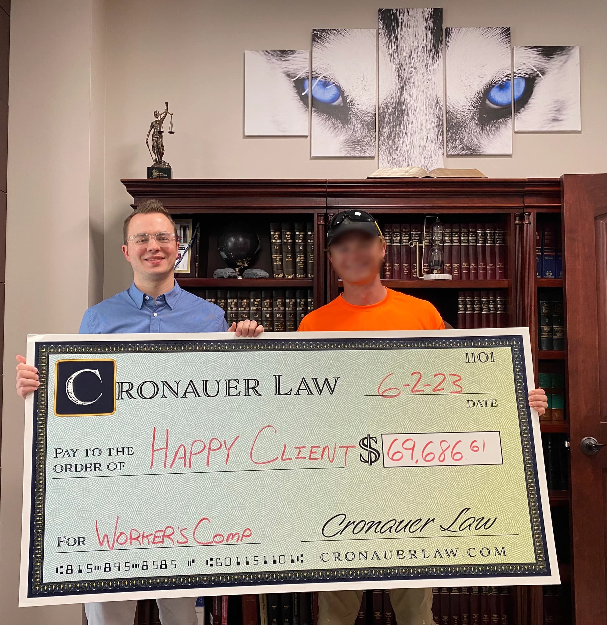 Cronauer Law client receiving settlement check