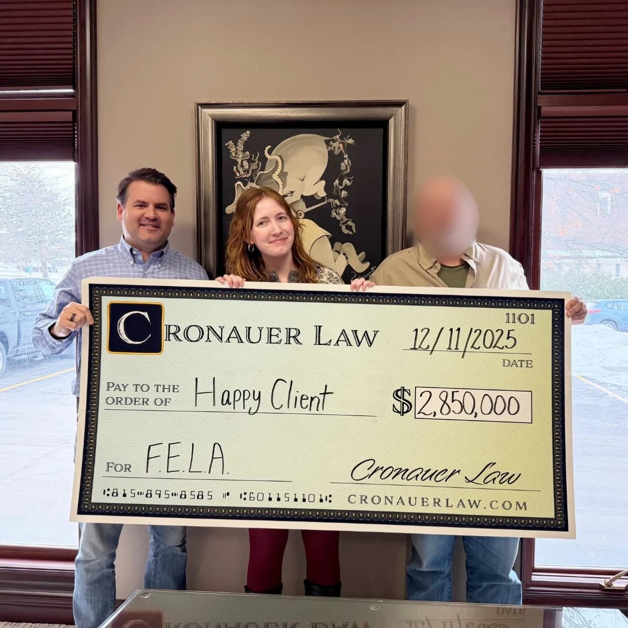 Cronauer Law client receiving settlement check